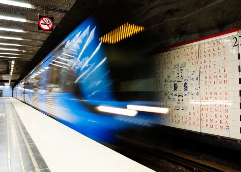An underground train arrives.