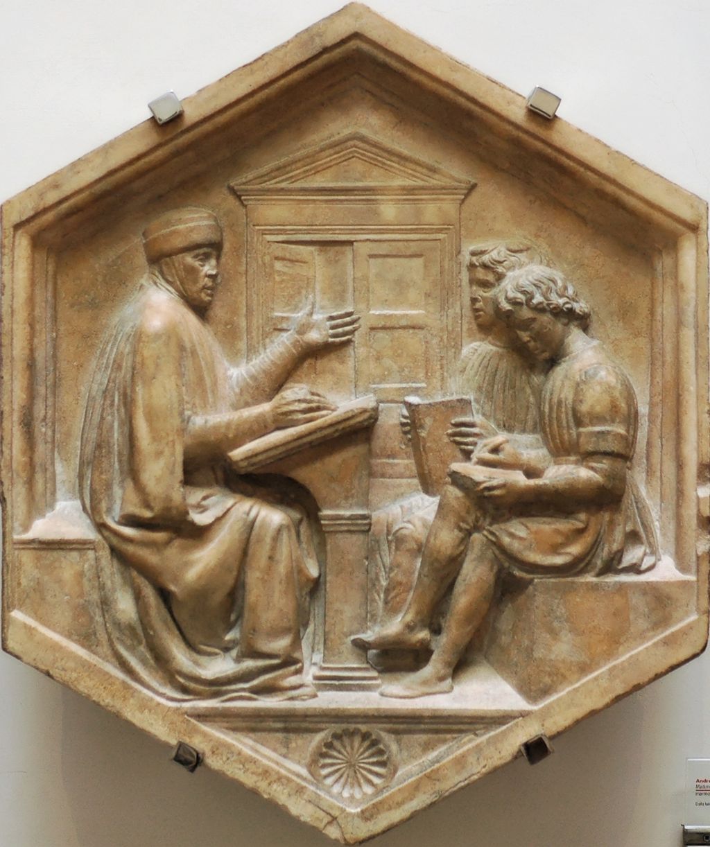 Luca della Robbia, Priscian, or the Grammarian (1437-1439). Marble panel from the North side, lower basement of the bell tower of Florence, Italy. Museo dell'Opera del Duomo. Foto: Luca della Robbia, Public domain, via Wikimedia Commons