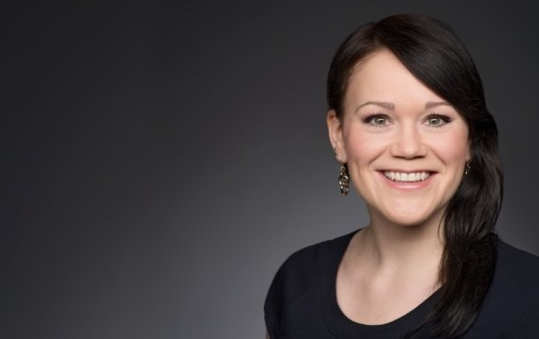 Ulrike Schimpf is a woman with dark brown hair, smiling at the camera.