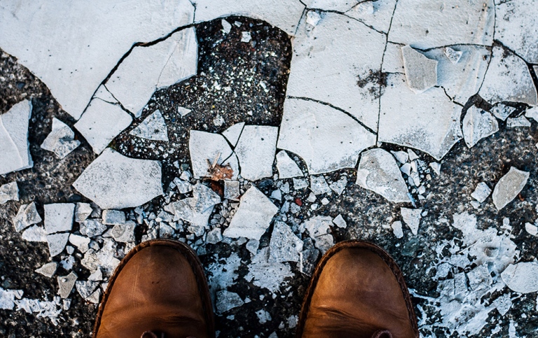 Shoes on withering ground.