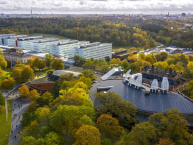 An aerial view of a city surrounded by trees.