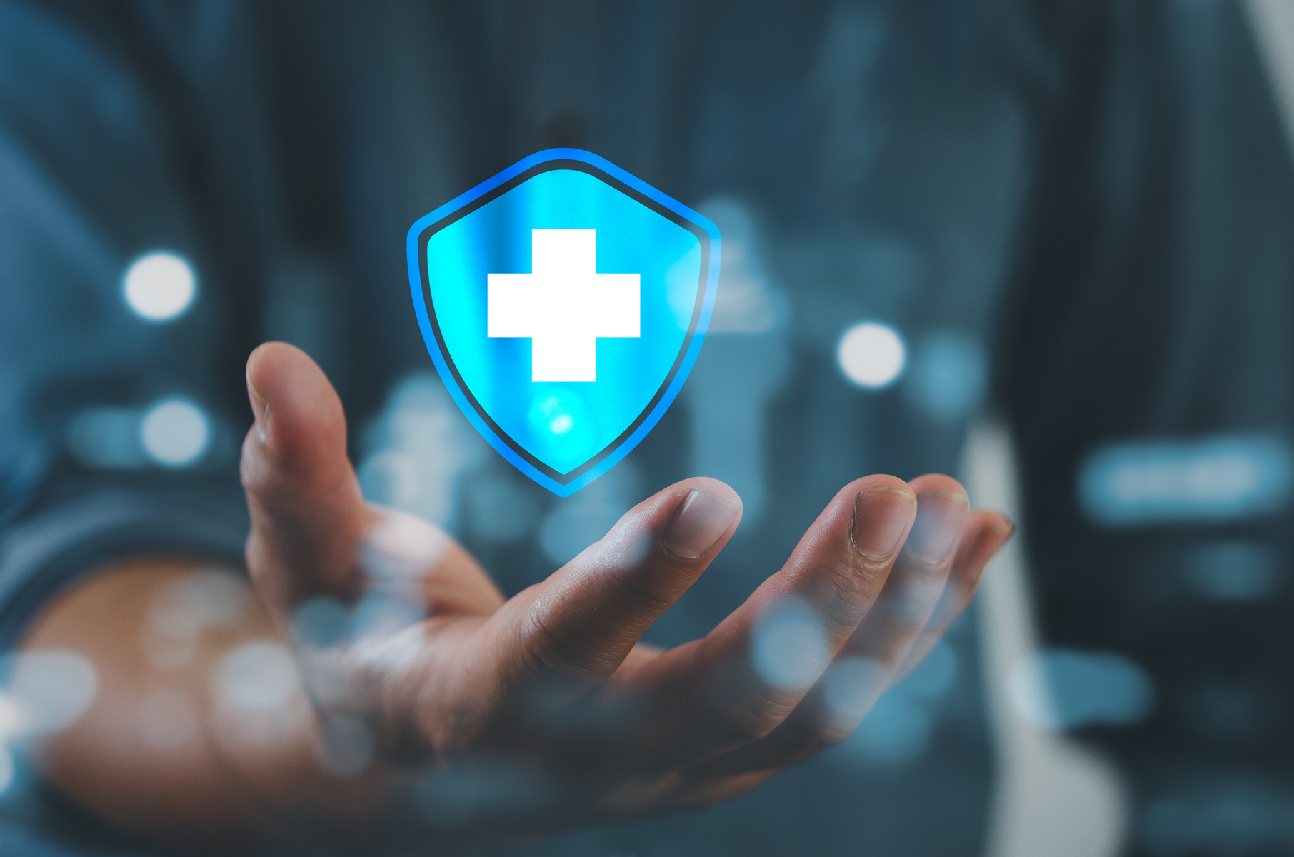 Man hand holding virtual medical health care icons with medical network connection.