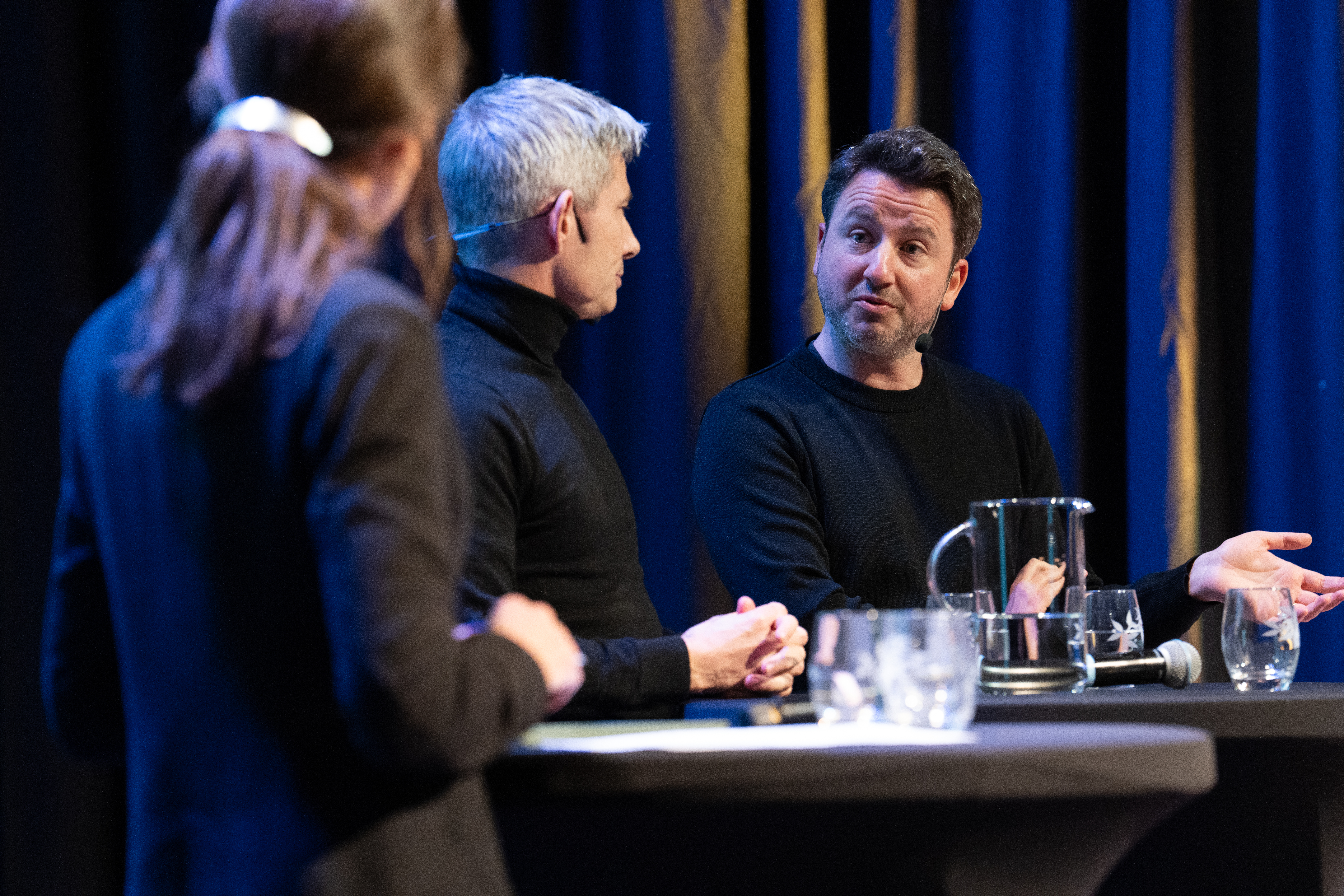 Gabriel Zucman and Daniel Waldenström at stage