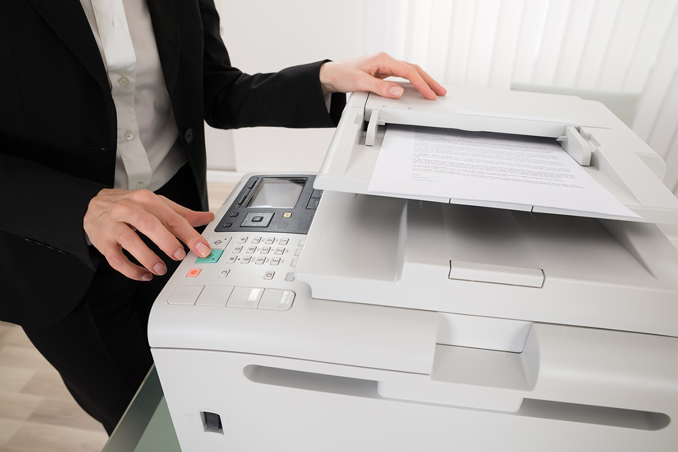 Woman operationg a printer
