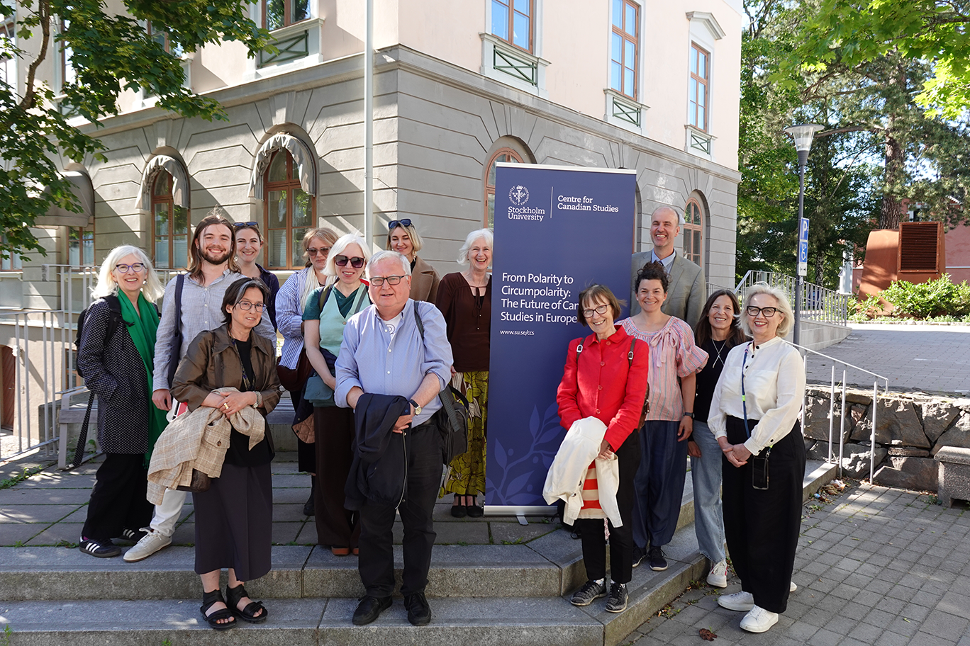 Group photo of conference participants from "From Polarity to Circumpolarity: The Future of Canadian Studies in Europe" at the Centre for Canadian Studies, Stockholm University. The participants pose on outdoor steps in front of a banner displaying the conference title.