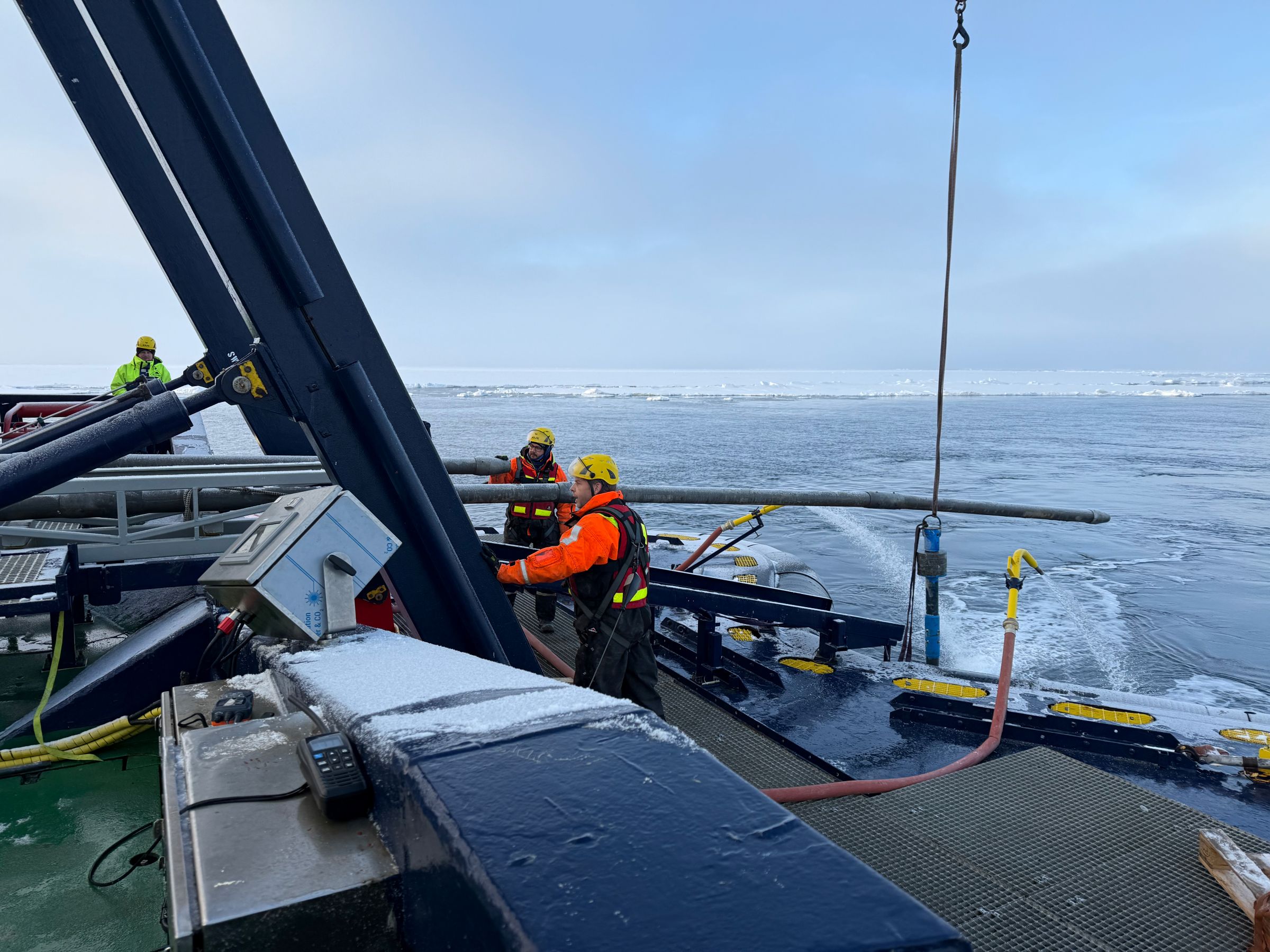 Richard Gyllencreutz and Matt O’Regan guiding the 12 m long piston corer (used for collecting sediment cores from the seafloor) into the sea.