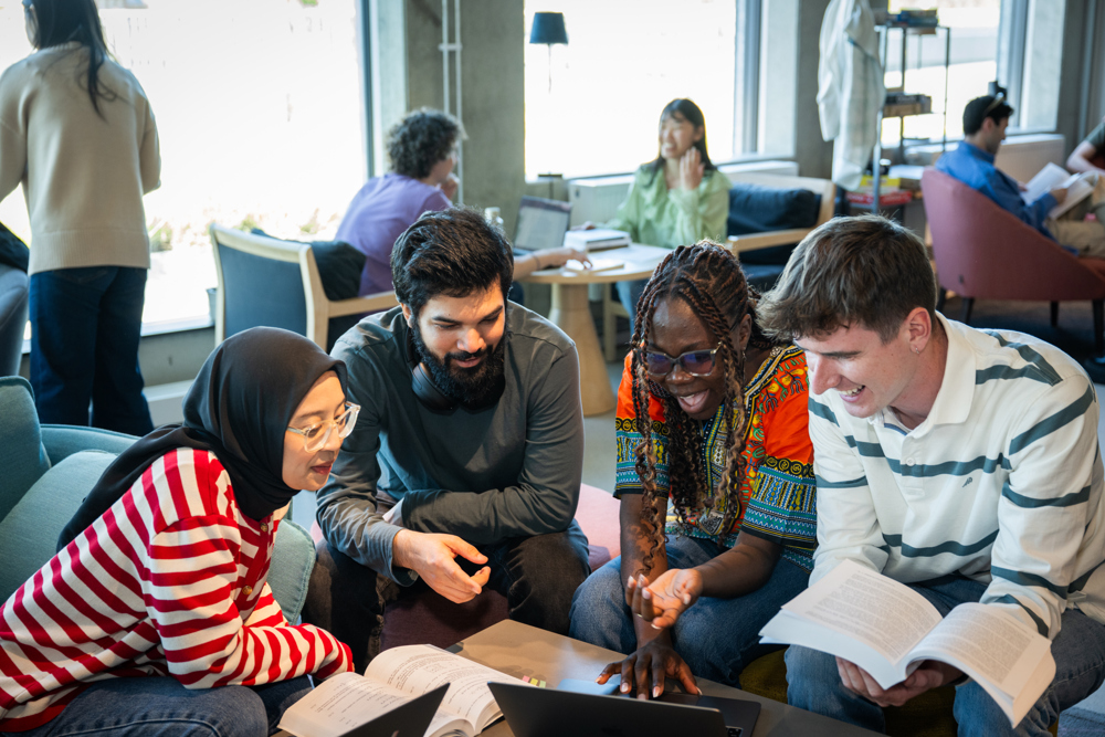 Students at Stockholm University sitting in a group. 