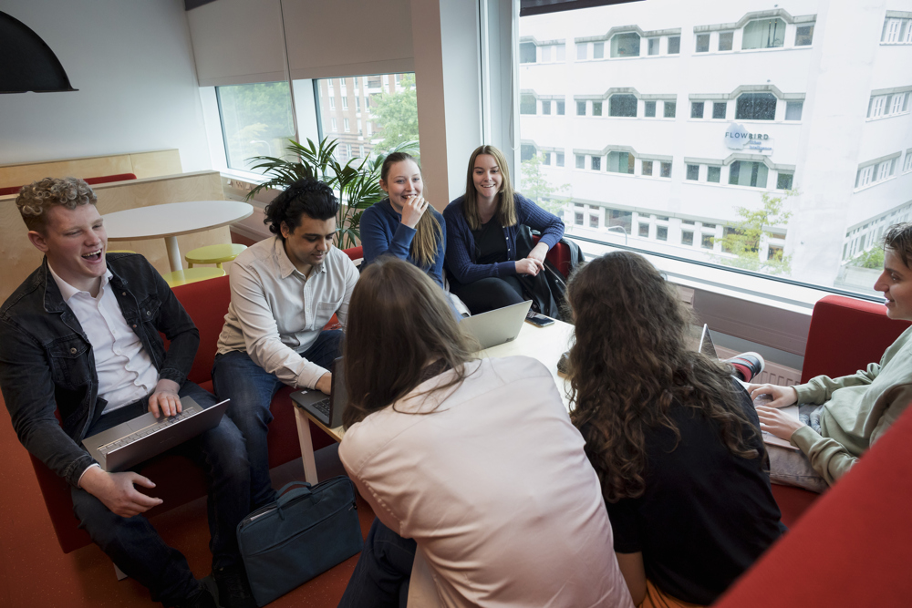 Students sitting in a group in the Nod Building. 