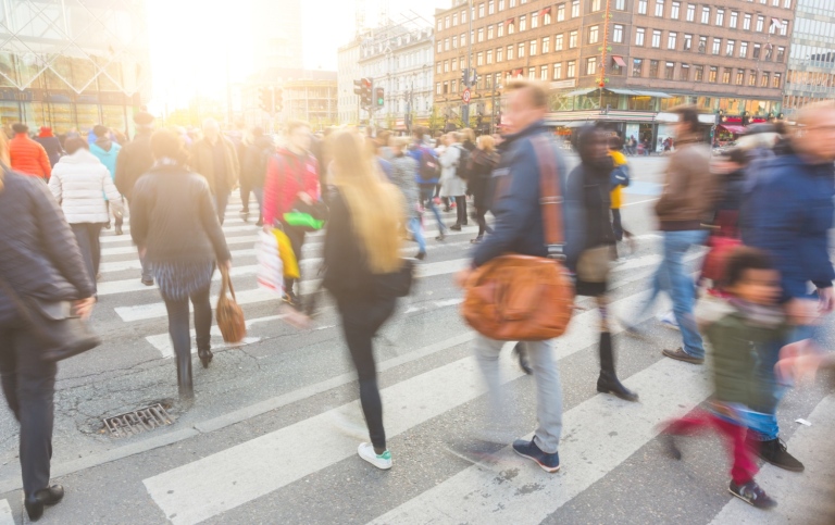 Blurry crowd crossing street