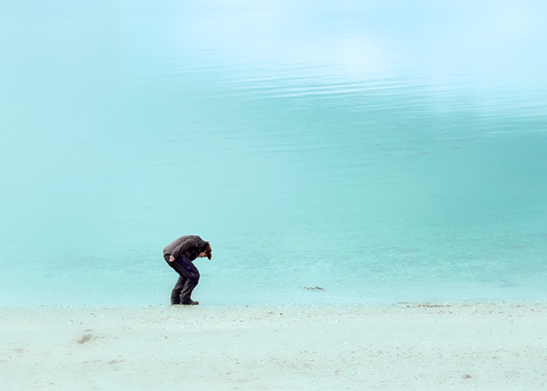 Man in a suit on a beach