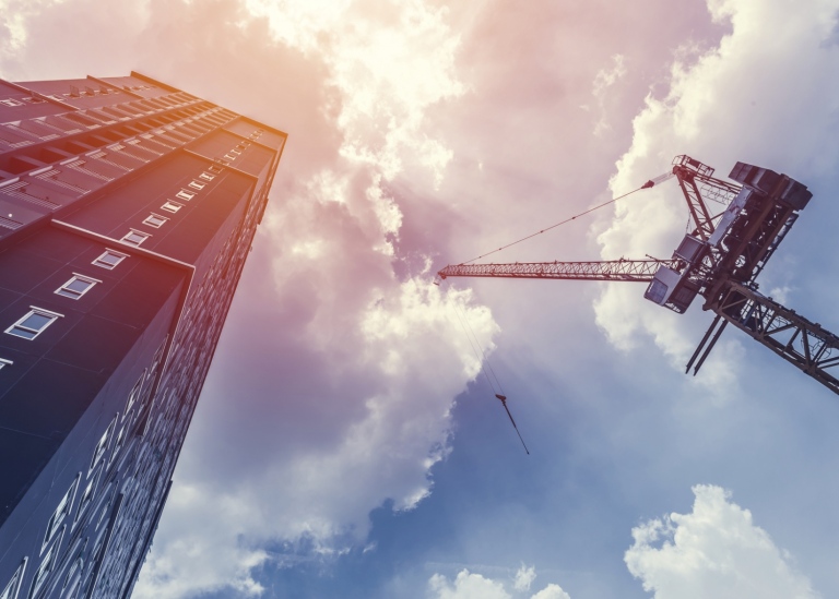 Construction crane and high building