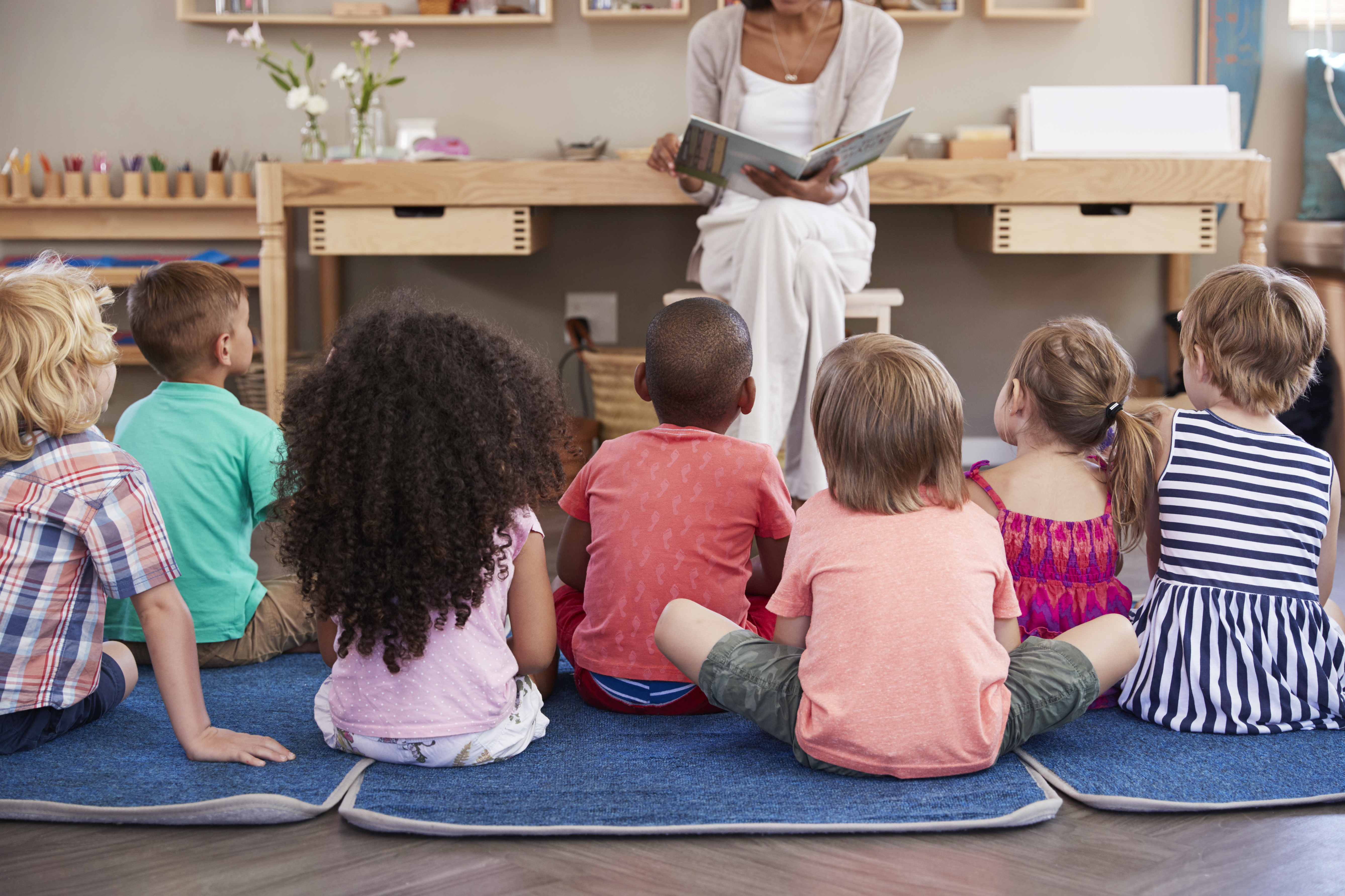 Teacher reading to children