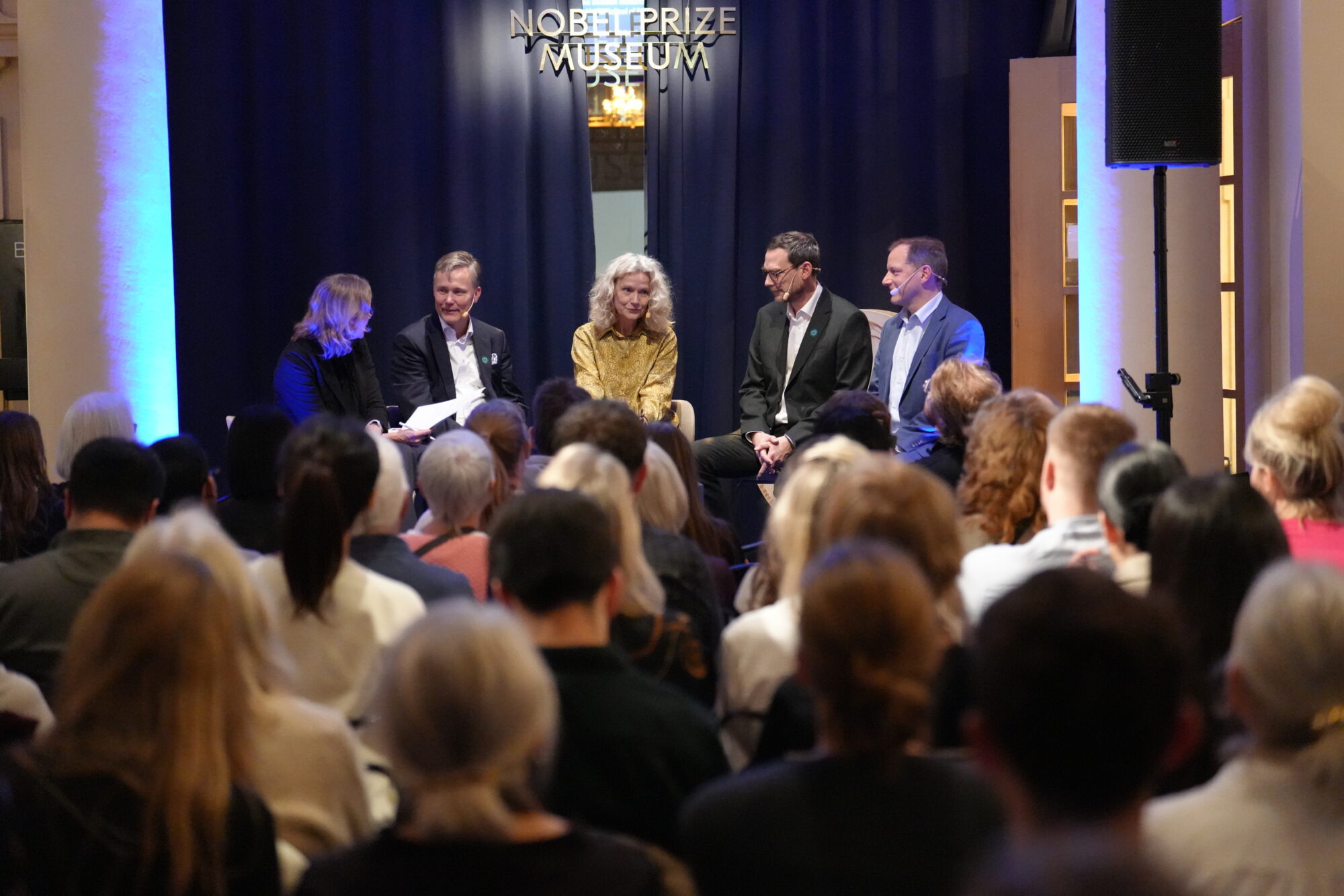 Panelists on stage at the Nobel Prize Museum.
