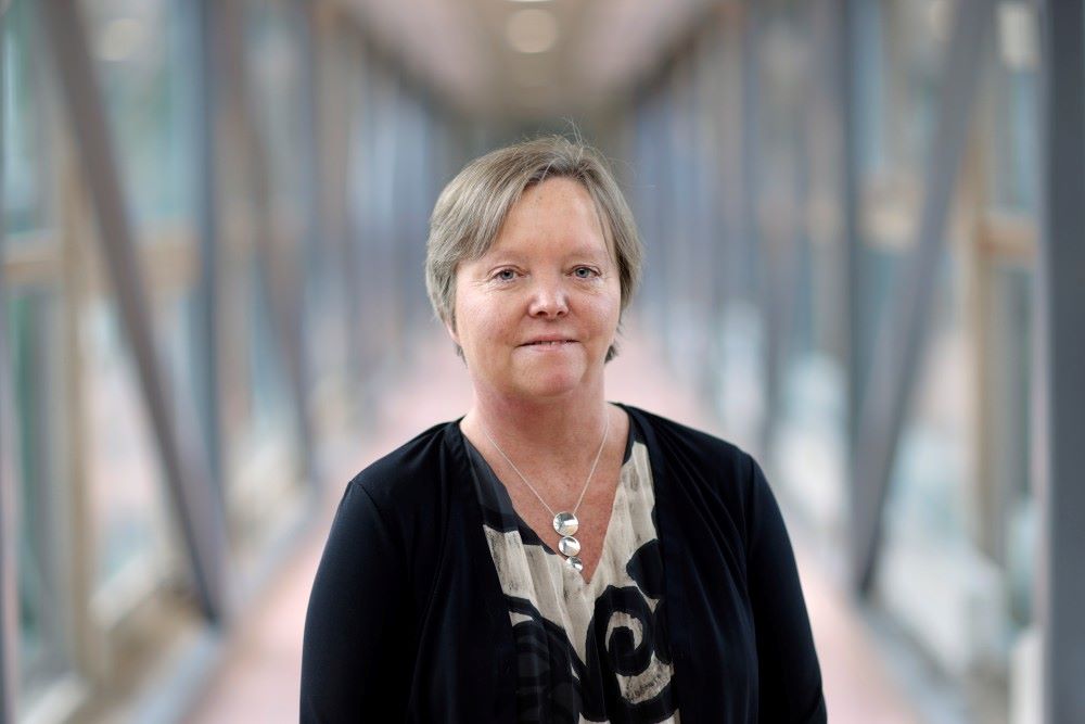 Lena Mäler is wearing a patterned blouse.