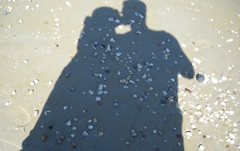 Shadow of kissing couple