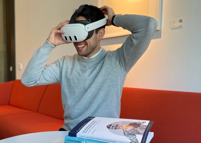 Luis Quintero, DSV, trying on a VR headset.