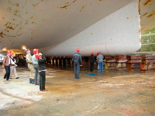 People standing looking up to icebreaker, detailed photo