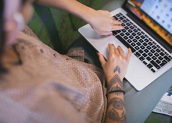 Picture of hands typing on laptop
