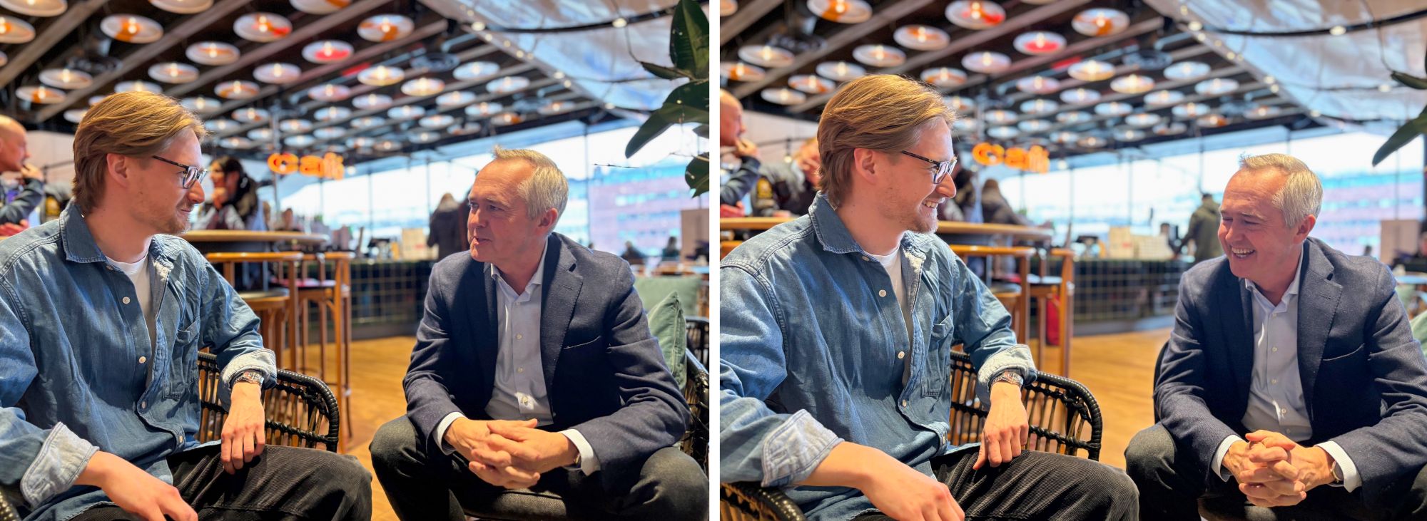 Two men in armchairs having a conversation.
