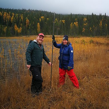 Researchers collecting sediment