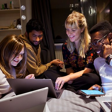 Students looking at their laptops