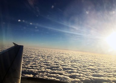Airplane wing and clouds. 
