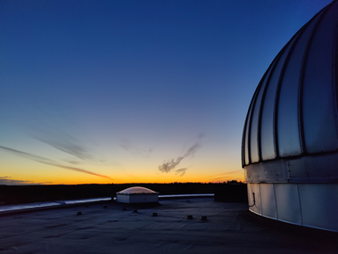 The AlbaNova Telescope in late evening.