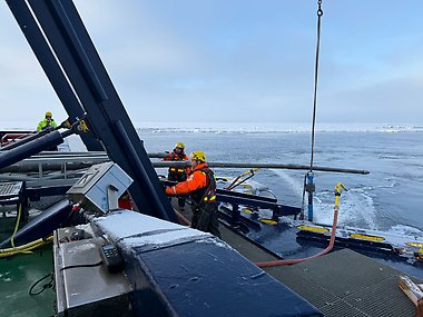 Richard Gyllencreutz and Matt O’Regan guiding the 12 m long piston corer (used for collecting sediment cores from the seafloor) into the sea.