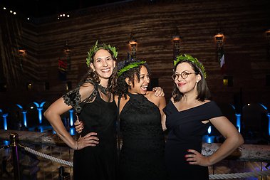 Three happy girls with laurel wreaths.