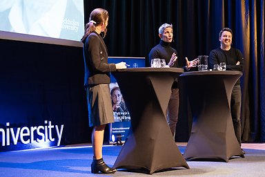 Moderator Mia Odabas and economists Daniel Waldenström and Gabriel Zucman on stage.
