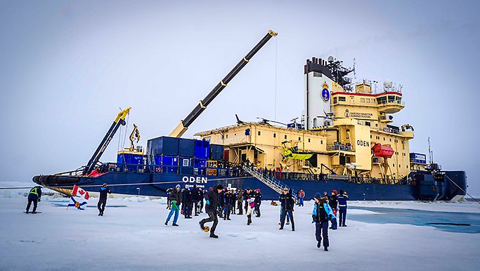 Icebreaker Oden and crew members and PhD students playing games on the ice.