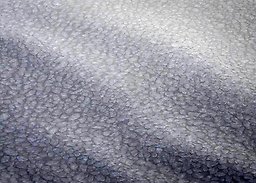 Lots of ice floes packed together, and from above it looks like waves.