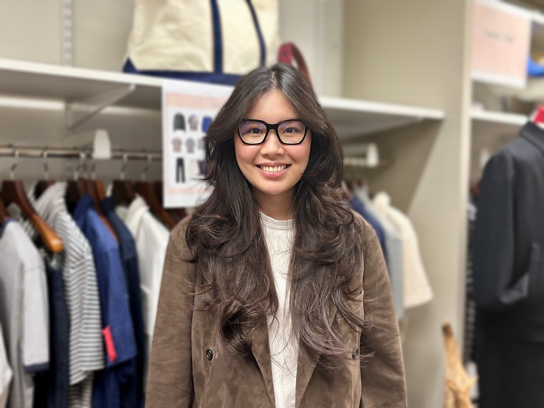 Alumna Nhi in a clothes shop.