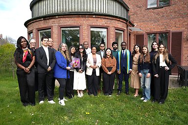 The graduates outside the Faculty Club.