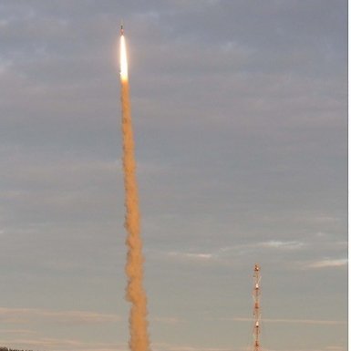 Glowing rocket and engine smoke.