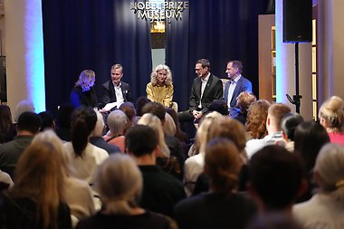 Panelists on stage at the Nobel Prize Museum.