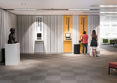 Visitors returning books at the library