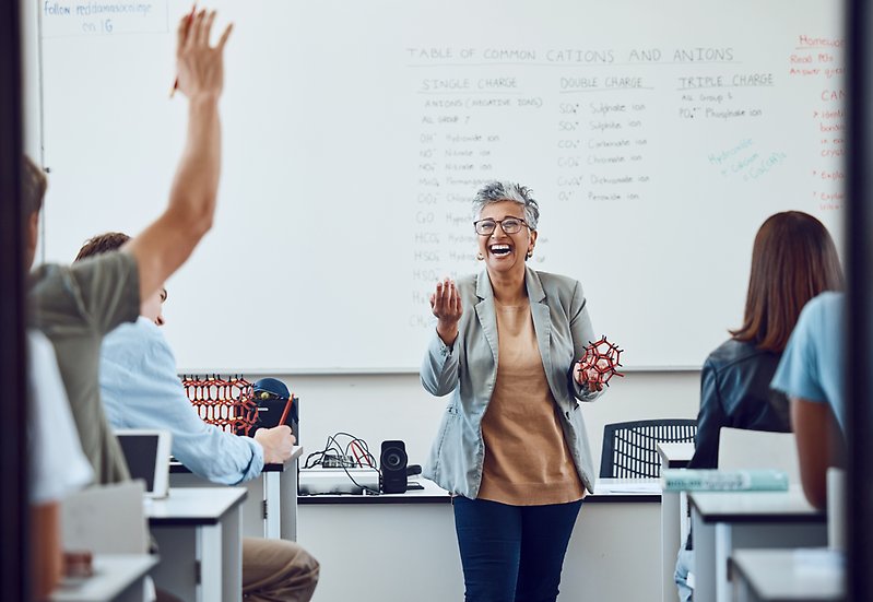 Smiling teacher in classroom