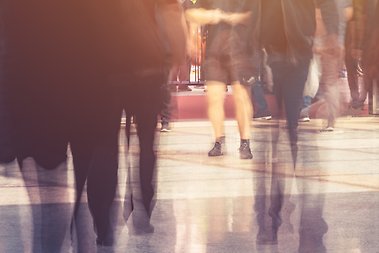 Blurred picture of a crowd in public rush hour.