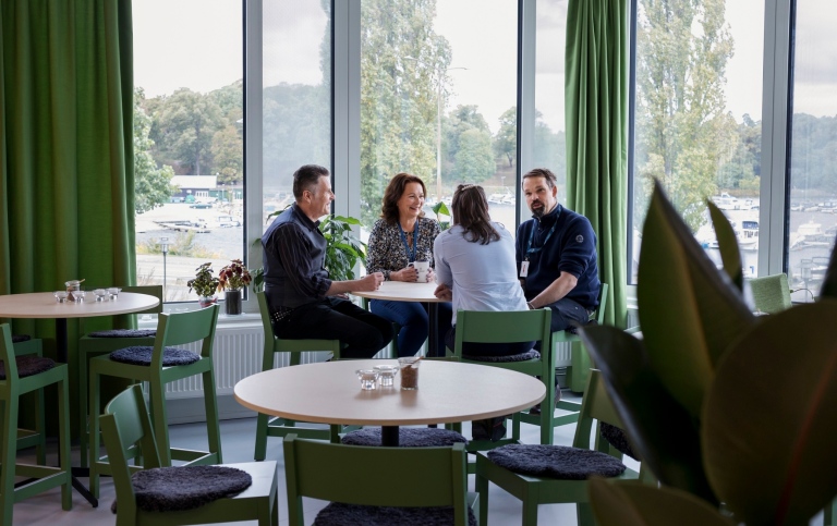 Four people around a lunch table